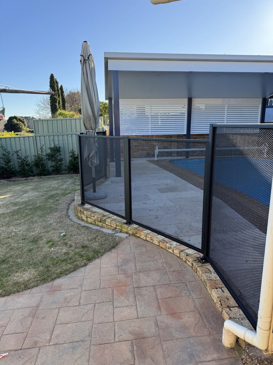 Curved Pure Perf pool fence in Textured Black, Sydney